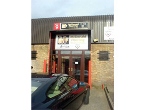 two aluminium signs for mcdonald flooring